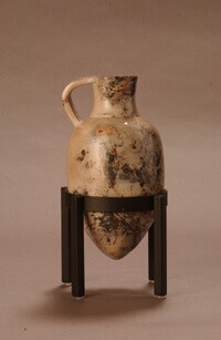 Antique amphora jug with stand.